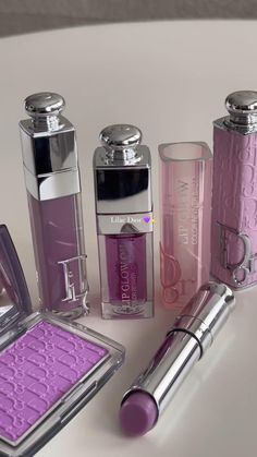 A captivating image showcasing Dior's lilac collection, featuring a range of lilac-hued beauty products, evoking a sense of elegance, sophistication, and beauty perfection. Cosmetics By Brand, Purple Lip Gloss, Dior Lipgloss, Dior Cosmetics, Dior Lipstick, Beauty Video Ideas, Pinterest Makeup, Dior Makeup, Dior Beauty