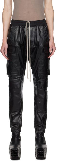 Slim-fit lightweight coated stretch denim cargo pants. · Drawstring at elasticized waistband · Four-pocket styling · Button-fly · Cargo pockets at front legs · Elasticized cuffs Supplier color: Black Denim Cargo Pants, Denim Cargo, Slim Fit Pants, Slim Pants, Drawstring Pants, Rick Owens, Stretch Denim, Cargo Pants, Apparel Accessories