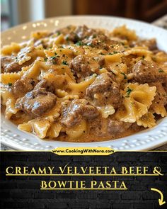 a white plate topped with pasta and meat covered in sauce next to a sign that says creamy velveeta beef & bowtie pasta