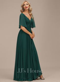 a woman in a long green dress