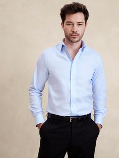 Designed for ease of wear and care, this sleek dress shirt employs a special cotton fabric with PUREPRESS™ cotton technology, a special process that smooths and protects the fabric, resulting in a wrinkle-resistant finish.  Slim fit with darts at the back.  Spread collar.  Shirttail hem.  Slim fit.  Long sleeves.  Hip length.  Model: Size M, 6'2" (188cm). Mens Banana Republic, High Top Adidas, Blue Dress Shirt, Sleek Dress, Toddler Jeans, Curve Jeans, Glen Plaid, Men Shirt Style, Workwear Dress