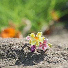 Adorn your finger with vintage elegance and modern charm with our Sweet Grape Flower Ring. This beautiful piece features a gold brass enamel and is crafted with a nod to cottagecore style. Whether it’s for yourself or as a special gift, this ring is sure to add a touch of nature-inspired beauty to any ensemble. DETAILS Plating: 18k Gold  Materials: 18k Gold on Brass, Enamel Size:  Adjustable Weight:  4.5g Mini Vineyard, Grape Flower, Autumn Jewelry, Unique Gift Wrapping, Cuban Link Chain Necklaces, Detailed Necklace, Hand Necklace, Opal Pendant Necklace, Cottagecore Style