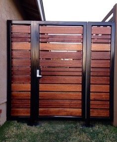 a wooden gate in front of a house