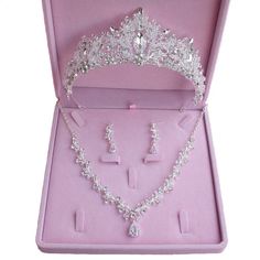 a tiara and jewelry set in a pink box