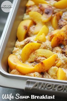 a casserole dish with sliced peaches and cinnamon on top in a pan