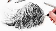 a drawing of a man's head with long hair and pencils next to it