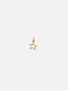 For the daydreamers. Shoot for the stars in this mini star charm. Wear this on Mandy Reid's signature Paperclip chain next to your favorite initial. Solid 14k gold Charm measures 1/2" in height Made in New York Shoot For The Stars, Authentic Jewelry, Shooting Stars, Star Charms, Gold Charm, Paper Clip, Initials, Yellow Gold, New York