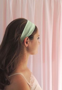 "Mint green silk headband Our silk satin headbands are perfect for old school retro glamour. These individually made silk headbands are designed to be wide enough to be worn either flat or folded with small pleats at the sides. With a beautiful sheen, stretch silk satin has got to be the softest way to hold your hair back either on casual days or to bring vintage glamour to an evening outfit. An elastic strap covered with silk satin holds your hair band comfortably onto your head. Each headband 2023 Palette, Strawberry Shortcake Costume, Mint Green Hair, Green Headband, Glamour Vintage, Retro Glamour, Evening Outfit, Silk Headband, Vintage Headbands