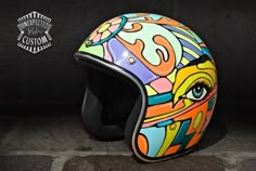 the helmet is decorated with colorful images