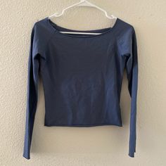 Cotton Blend Off The Shoulder Long-Sleeve Top With A Raw Hem. Fabrics: 96% Cotton, 4% Elastane Measurement: 19"(48 Cm) Length, 18"(46 Cm) Bust Made In: Italy Fitted Casual Tops In Denim Blue, Casual Fitted Denim Blue Top, Blue Relaxed Fit Long Sleeve Top With Crew Neck, Fitted Blue Crew Neck Blouse, Fitted Blue Blouse With Crew Neck, Stretch Denim Blue Top For Spring, Blue Casual Long Sleeve Top For Fall, Casual Blue Long Sleeve Top For Fall, Fitted Blue Long Sleeve Top For Spring