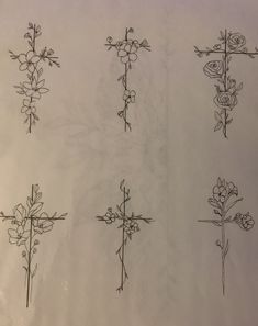 six crosses with flowers and vines drawn on them