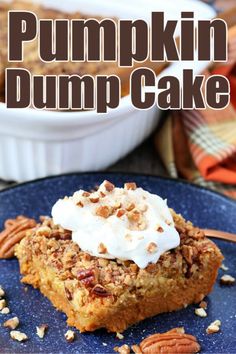 pumpkin dump cake on a blue plate with pecans and whipped cream in the background