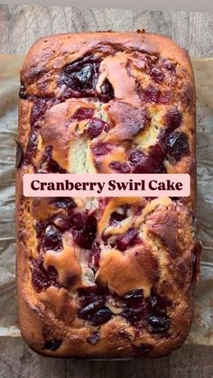 a loaf of cranberry swirl cake sitting on top of a piece of tin foil