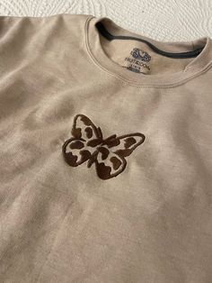 Embroidered Monochrome Cow Butterfly Sweatshirt |Embroidered Sweatshirt ✰ The photo sample is the Sand hoodie ✰ Available as a hoodie or crewneck sweatshirt ✰ SIZING - Please review the size chart to select the best fit. All sweatshirts are unisex. ✰ FEATURES relaxed fit soft-fleece lining ✰ MATERIALS ring-spun cotton/polyester 8-ounce, 50/50 cotton/poly Double-needle stitching at waistband and cuffs 1x1 rib knit collar, cuffs, and waistband with spandex ✰ REFUNDS / RETURNS / EXCHANGES - All items are made to order and are not eligible for refunds, returns, or exchanges.  ✰ CARE INSTRUCTIONS cold wash | 30oC or 85oF non-chlorine bleach if needed permanent press, low heat do not dry clean ✰ PROCESSING TIME 3-5 days  ✰ NEED ADDITIONAL INFORMATION? If you have any questions send me a message. Summer Crew Neck Tops With Butterfly Embroidery, Nike Embroidered Sweatshirt Butterfly, Butterfly Hoodie Design, Butterfly Sweatshirt, Butterfly Sweat Shirt, Dog Lover Sweatshirt, Cute Notes, Embroidered Sweatshirts, Cow Print