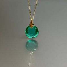 14K Gold Colombian Emerald  Necklace,  Oval Pendant, May Birthstone, Green Stone Necklace, Layering Necklace, Handmade By NAMATAdesigns. Stunning Colombian emerald necklace showcasing an oval-shaped faceted pendant with pristine clarity, radiating a mesmerizing ocean-green hue. The exquisite pendant, which beautifully reflects light, is affixed to bail and hangs delicately from a chain available in 14K Gold Fill, Sterling Silver, or Rose Gold Filled chain. The necklace exudes elegance, offering Green Stone Necklace, Ocean Green, Necklace Layering, Gold Fashion Necklace, Solid Gold Chains, Emerald Pendant, Colombian Emeralds, May Birthstone, Emerald Necklace