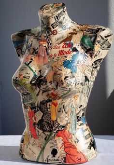 a mannequin made out of various types of stickers on it's body