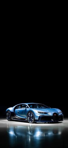 a bugatti car is shown in the dark