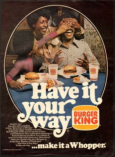 an advertisement for burger king with two women and one man sitting at a table eating hamburgers