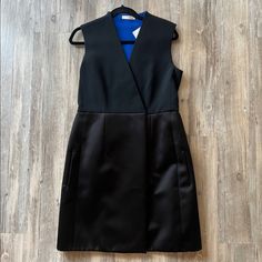 New With Tags, Never Worn. Authentic Celine From The Phoebe Philo Era. Black Dress With Blue Inside. Inner Button And Outer Hook Closure At The Front. Approximate Measurements Bust 35.5”, Hips 40”, Length 36.75”, Waist 33.25” Black Sheath Dress For Semi-formal Occasions, Black Sheath Midi Dress For Semi-formal Occasions, Silk A-line Mini Dress For Work, Black Silk Knee-length Mini Dress, Black Career Dresses For Spring, Black Mini Dress For Work, Black Silk Midi Dress For Work, Black Career Dresses, Black Silk Semi-formal Dress