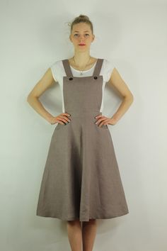 "Handmade coffee dress sleeveless and 2 pockets , perfect for casual wear and suitable for any occasion in any season Details: - 100% natural linen produced in Europe ; - medium weight (180 gram per square meter); - color: coffee, could be any from our colors catalog (color samples at the photo); Made to order, approximately a few days, If you have any questions please message me and I will be glad to answer. Size guide : Size XS Bust: fits bust around 33\"-34\"/ 84-88 cm Waist: fits waist aroun Brown Sundress With Adjustable Straps, Sleeveless Cotton Suspender Dress With Pockets, Brown Midi Dress With Pockets For Summer, Brown Summer Midi Dress With Pockets, Brown Linen Dresses With Pockets, Cotton Sleeveless Pinafore Dress With Adjustable Straps, Sleeveless Beige Midi Dress With Pockets, Casual Brown A-line Sleeveless Dress, Brown Cotton Dresses With Pockets