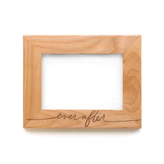 a wooden frame with the word ever after written in cursive writing on it