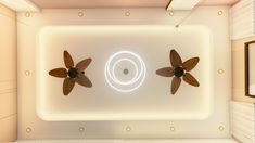 two ceiling fans in the middle of a room with white walls and lights on either side