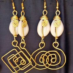 "Shell and brass earrings" Shells Earrings, African Inspired Jewelry, Cowry Shell, Wire Jewellery, African Earrings, Cowrie Shells, Cowrie Shell, Inspired Jewelry, Cool Necklaces