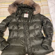 Moncler Boed With Fur Only Used Once Purchased A Size 1 And Was Given A Size 3 Didn’t Realized The Error And Due To The Pandemic I Didn’t Give Any Wear To This Beautiful Coat Until Now Used Once Authentic Size 3 Color Olive Color Is Discontinued Comes With Hanger And Dust Bag No Stains No Flaws Used Once Excellent Condition Measurements 20 Inches From Armpit To Armpit 18inches Waist 26 Inches Long Designer Green Winter Outerwear, Designer Fitted Puffer Jacket For Winter, Black Puffer Coat, Moncler Women, Long Puffer Coat, Puffy Coat, Moncler Jacket, Long Puffer, Down Puffer Coat