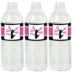 three plastic water bottles with labels on them