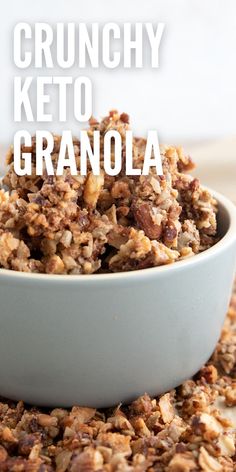 a white bowl filled with granola on top of a table