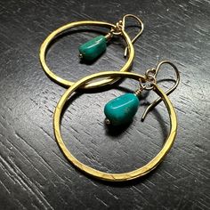 These small, gorgeous, raw Apatities are hand-wrapped with our 14K gold wires into Small-sized, 24K Gold hoops. (We've been up-leveling some 永 designs by adding a thick electroplating of 24K gold over our cast brass medallions- this combo allows for all the beauty and durabliity of the Gold finish while being much a more affordable option than solid cast gold!) Turquoise is perhaps the oldest decorative stone in mankind's history, the Taliswoman of Kings and Queens, Shamans, and Warriors. It is Turquoise Brass Hoop Earrings For Gift, Turquoise 14k Gold Filled Bohemian Earrings, Bohemian Turquoise 14k Gold Filled Earrings, Handmade Turquoise Brass Earrings, Mod Earrings, Raw Turquoise, Small Gold Hoops, Bohemian Turquoise 14k Gold-filled Earrings, Wholesale Gifts