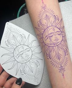 a woman's arm with a sun and moon tattoo on it