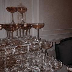 a table topped with lots of wine glasses