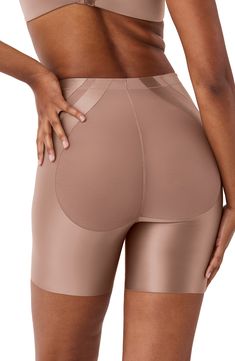 Shorts made from stretch satin fabric are served with sheer details and engineered to target the tummy and the thighs. The breathable, quick-dry fabrication keeps you cool and comfortable with each wear. 6" inseam Medium compression Cotton-lined gusset 72% nylon, 28% elastane with 65% nylon, 35% Lycra® Xtra Life™ elastane contrast Machine wash, dry flat Imported Affordable Stretch Nylon Bottoms, Cheap Breathable Nylon Bottoms, Cheap Seamless Nylon Bottoms, Compression High-cut Shorts With Built-in Shorts, Compression Nylon Bottoms With Contoured Waistband, Stretch Nylon Mid-thigh Shapewear, Stretch Nylon Shapewear Mid-thigh Length, Compressive Shapewear Bottoms With Built-in Padding, Nylon Smoothing Short-length Bottoms