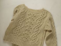 the sweater is knitted and ready to be worn for children's clothing creations