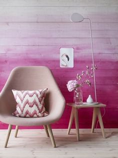 a pink room with two chairs and a table in front of the wall is featured on instagram