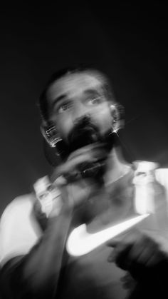 black and white photograph of a man eating food