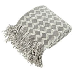 a gray and white blanket with fringes on it's ends, in the shape of an zigzag pattern