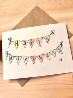 a handmade happy birthday card with bunting flags