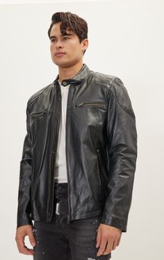 DETAILS Made from high quality leather, this jacket offers both comfortability and versatility. With a zip closure, the zippered sleeve cuff detail, and 2 chest zipper pockets, attention to detail was not spared with this design. This edgy, moto inspired jacket gives a more stylistic approach to the classic. This distinctive piece combines the rugged appeal of a moto-inspired design with the modern flair of shoulder patches, creating a unique and edgy style statement. Crafted with precision, the Leather Jacket With Zipper Pocket And Long Sleeves, Classic Black Outerwear With Zip Cuffs, Black Leather Outerwear With Zip Cuffs, Urban Leather Jacket With Ykk Zipper, Black Biker Jacket With Zip Cuffs For Work, Leather Biker Jacket With Zipper Pocket, Black Leather Biker Jacket With Zip Cuffs, Classic Black Biker Jacket With Zip Cuffs, Black Leather Jacket With Zip Cuffs For Work