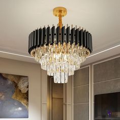 a chandelier hanging from the ceiling in a living room