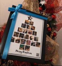 a christmas tree made out of photos with blue ribbon