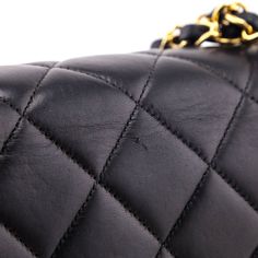 A rewrite on the classic 'Chanel Double Flap Bag', this Chanel offers its dual flaps within twin sets of single flaps. Each side of this black quilted lambskin bag offers a single flap, secured via gold-plated CC turnlock closure. The fixed shoulder strap offers the timeless Chanel look, with a woven leather & chain-link doubled over design. Inside this Chanel bag, an unquilted black leather interior offers a flat slip pocket on one side, and a flat zip pocket on the other. Timeless, with an unexpected design, this Chanel Black Quilted Lambskin Vintage Jumbo Double Sided Classic Flap Bag is the forever piece you've been searching for! Chanel Double Flap, Classic Chanel, Chanel Flap Bag, Classic Flap Bag, Black Quilt, Chanel Black, Classic Flap, Leather Chain, Exclusive Bag