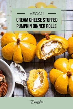 a table topped with oranges and nuts next to a bowl of cream cheese stuffed pumpkins