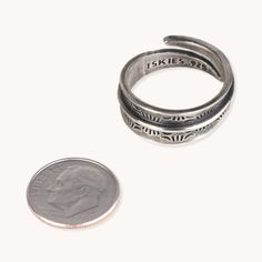 The Stamp Dancer: Carpenter Adjustable Ring is a great option for any stylish jewelry enthusiast. Crafted from ethically-sourced sterling silver, the handmade ring is adjustable for the perfect fit. Add a touch of sophistication to your look with this unique wrap ring. Sterling Silver Adjustable Ring 3/8" Width Rustic Patina Finish Adjustable Stackable Open Engraved Ring, Adjustable Sterling Silver Engraved Ring, Nickel Free, Adjustable Nickel-free Sterling Silver Engraved Ring, Adjustable Silver Open Ring Engraved, Adjustable Nickel Free Sterling Silver Engraved Ring, Adjustable Silver Engraved Open Ring, Adjustable Silver Vintage Midi Rings, Engraved Open Ring Jewelry, Adjustable Engraved Open Ring Jewelry