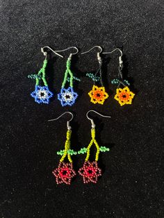 Adjustable Multicolor Flower Charm Earrings, Adjustable Multicolor Earrings With Flower Charm, Traditional Flower-shaped Earrings With Ear Wire, Traditional Handmade Flower Earrings As Gift, Unique Beaded Earrings With Bead Caps For Gift, Traditional Handmade Flower Earrings For Gift, Unique Multicolor Flower Earrings Gift, Yellow Flower Earrings With Colorful Beads For Gift, Bead Caps Drop Earrings As Gift