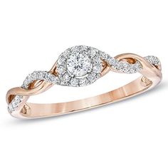 a rose gold ring with diamonds on the band and an oval shaped diamond in the center