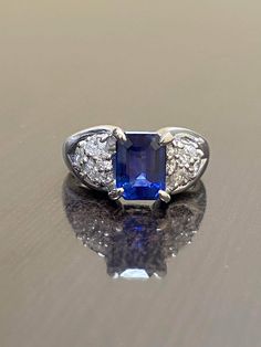 DeKara Design Collection Metal- 90% Platinum, 10% Iridium. Stones- 1 GRS Certified Heat Treated Emerald Cut Blue Sapphire, 12 Round Diamonds, 6 Marquise Diamonds F-G Color VS2 Clarity 0.46 Carats. GRS Report Number GRS2017-118196 Size- 5 3/4. FREE SIZING. Handmade Platinum One of a Kind Marquise and Round Diamond GRS Certified Emerald Cut Blue Sapphire Engagement Ring. This ring features a beautiful elongated blue sapphire that is a deep rich Royal Blue that has measurements of a 3 carat plus sa Emerald Cut Sapphire Ring, Blue Sapphire Engagement Ring, Handmade Engagement Rings, Claw Prong, Sapphire Engagement Ring Blue, Sapphire Engagement Ring, Marquise Diamond, Emerald Cut Diamonds, Sapphire Engagement