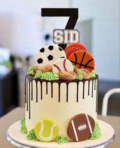 a birthday cake with sports themed decorations on it