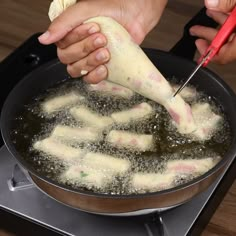 someone is cooking food in a pan on the stove